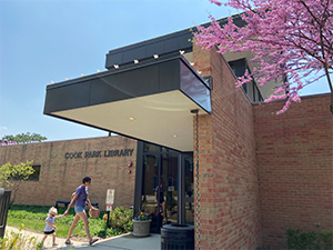 A woman and young child walking into the north entrance of Cook Park Library in Libertyville