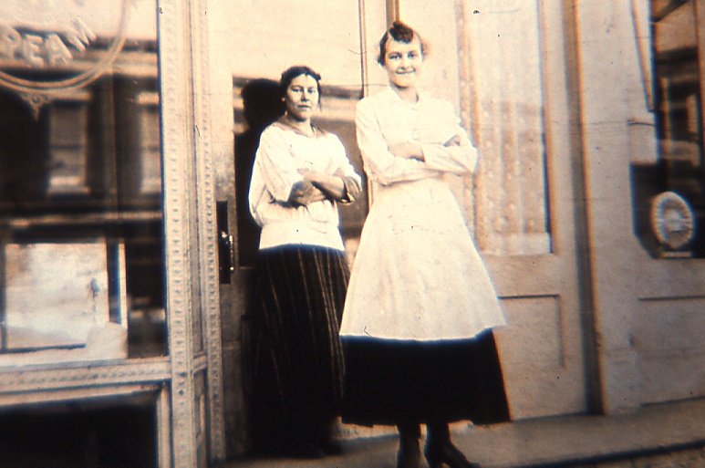 Two women standing in front of a Libertyville bakery. 1915.