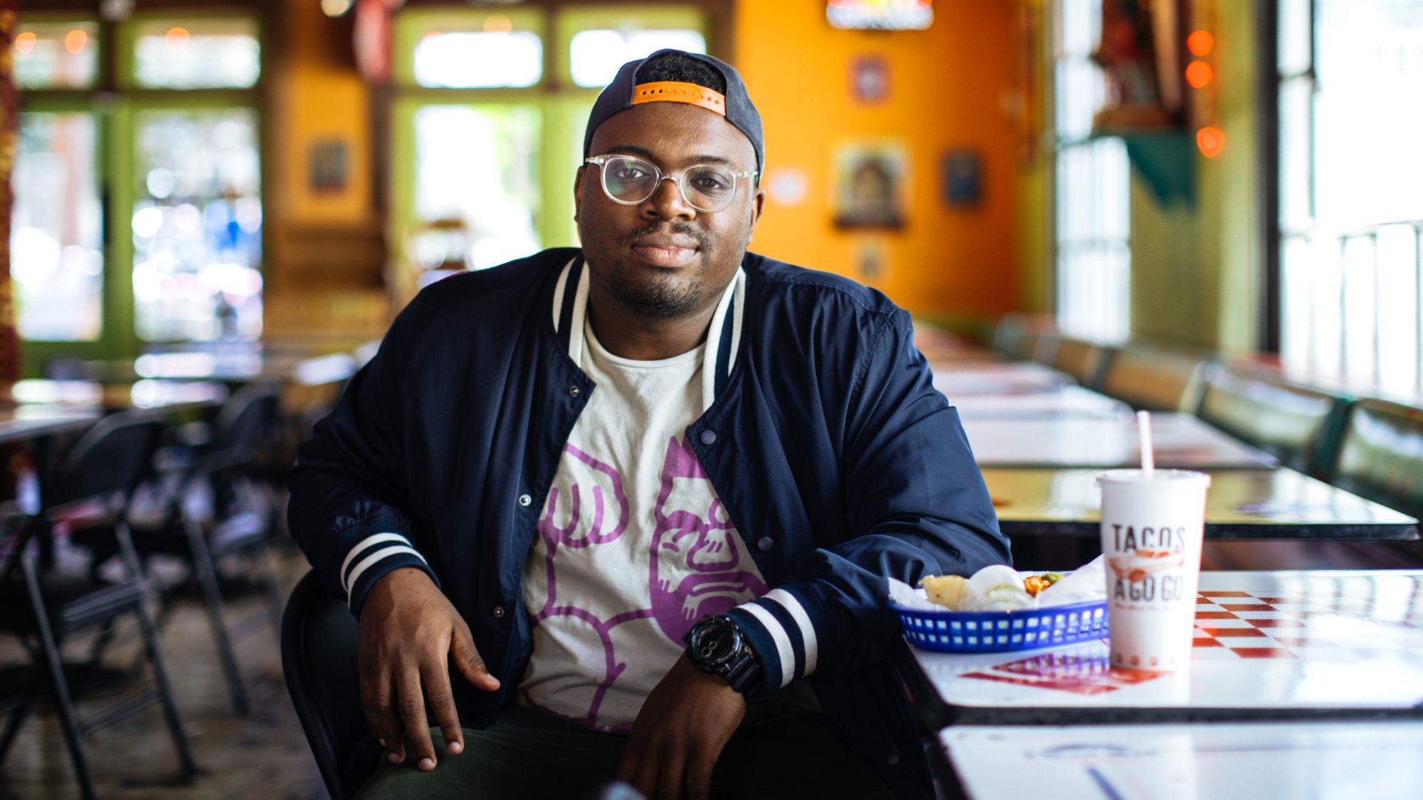 Bryan Washington at a table in a restaurant