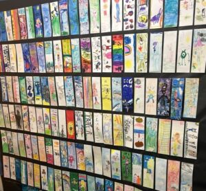Rows of hand drawn bookmarks on a black background